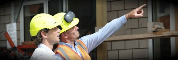 A health and safety officer scoping out a potential worksite construction issue. 