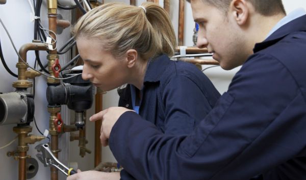 instructor helping student with hands-on learning