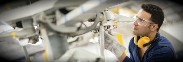 A mechanical engineer working on heavy machinery. 